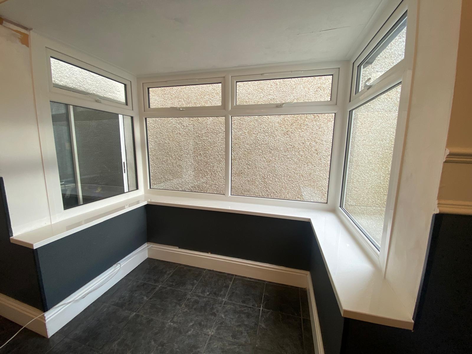White internal bay window with top vents and obscure glass