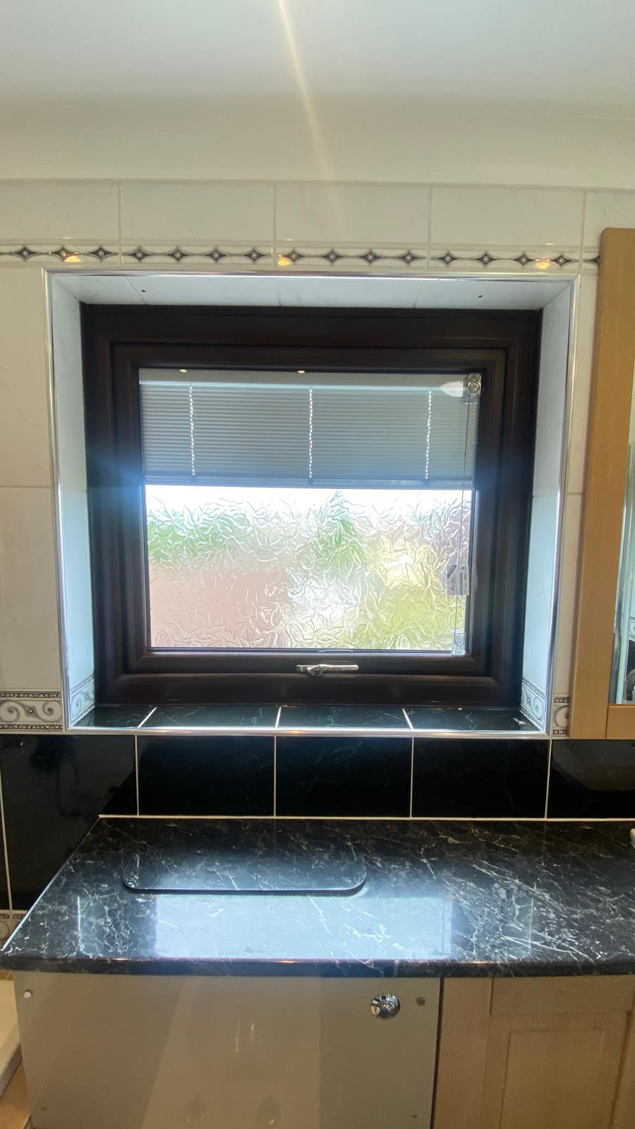 Dark brown kitchen window with obscure privacy glass