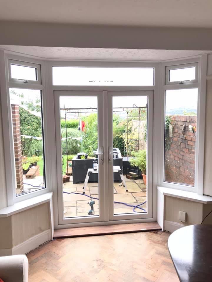 Finished French doors with side windows viewed from inside