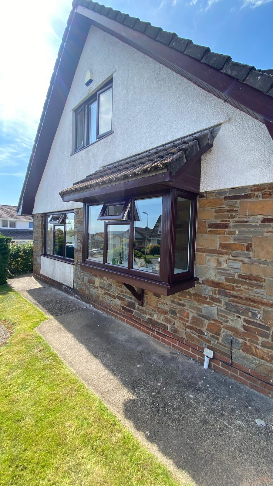 Rosewood brown bay window with top-opening vents