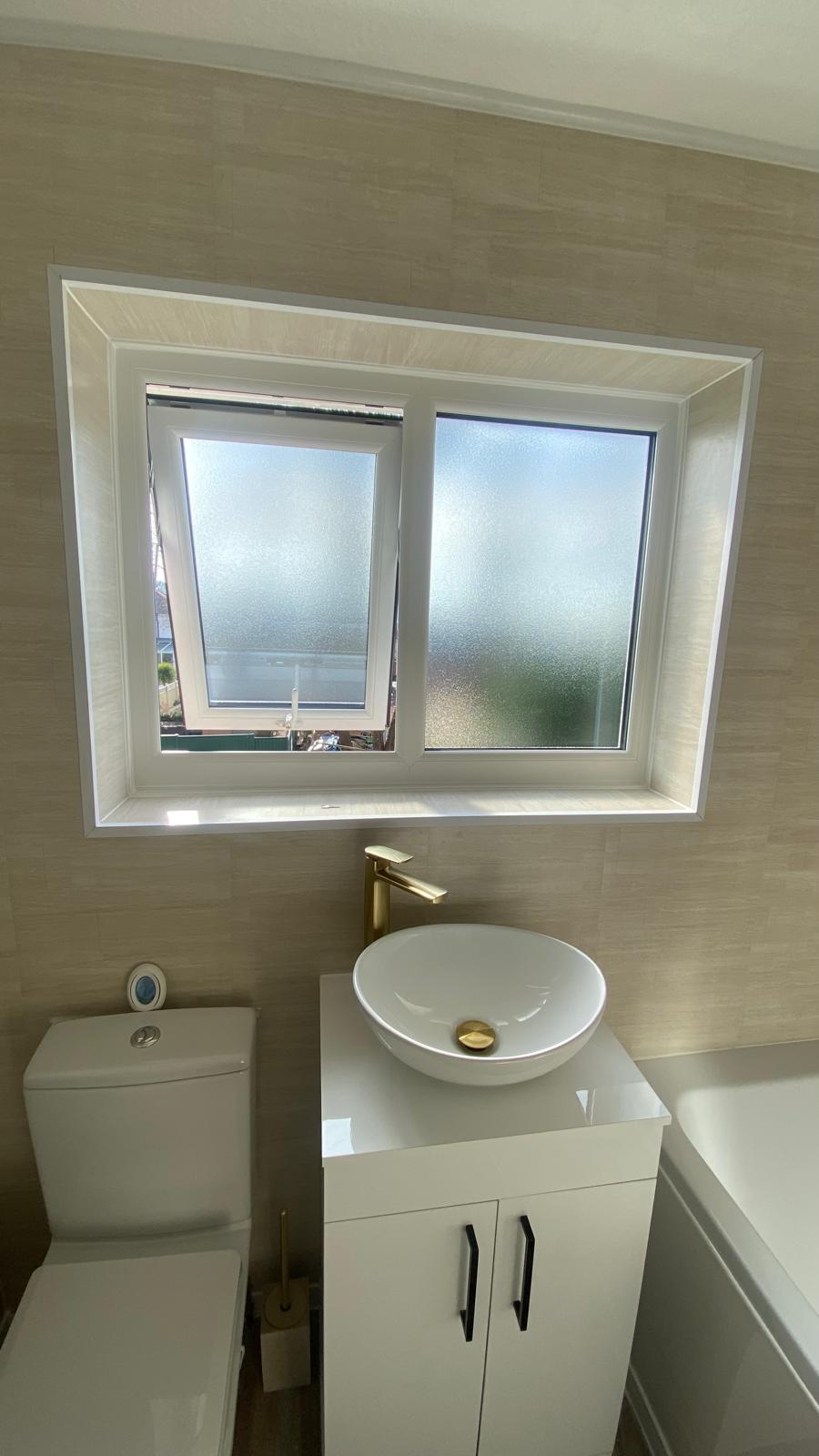 White bathroom window with frosted obscure glass and opening casement